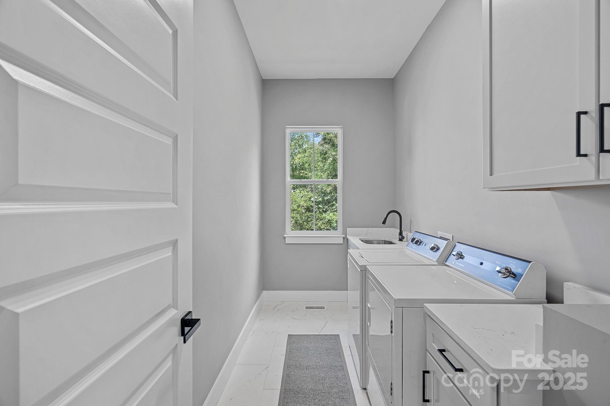 20615 Rio Oro Drive Cornelius, NC 28031 - Photo 15 of 40 a utility room with dryer and washer