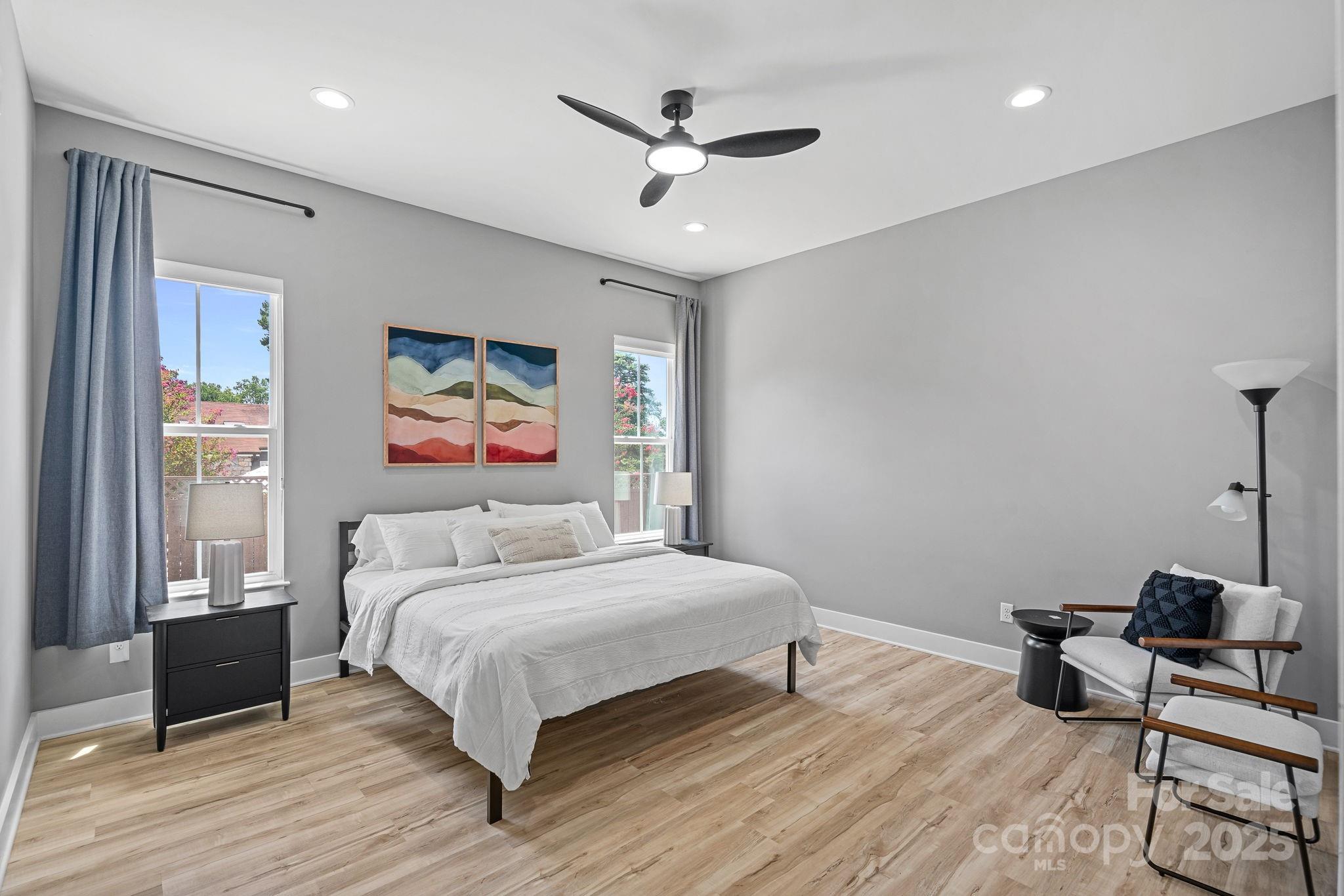 20615 Rio Oro Drive Cornelius, NC 28031 - Photo 18 of 40 a bedroom with a bed and wooden floor