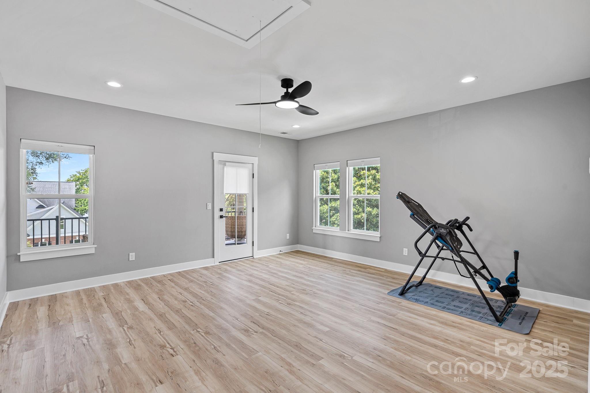 20615 Rio Oro Drive Cornelius, NC 28031 - Photo 22 of 40 a view of an empty room with a window and wooden floor