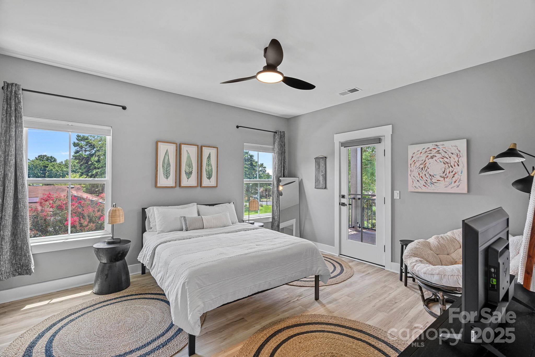 20615 Rio Oro Drive Cornelius, NC 28031 - Photo 23 of 40 a bedroom with a bed and wooden floor