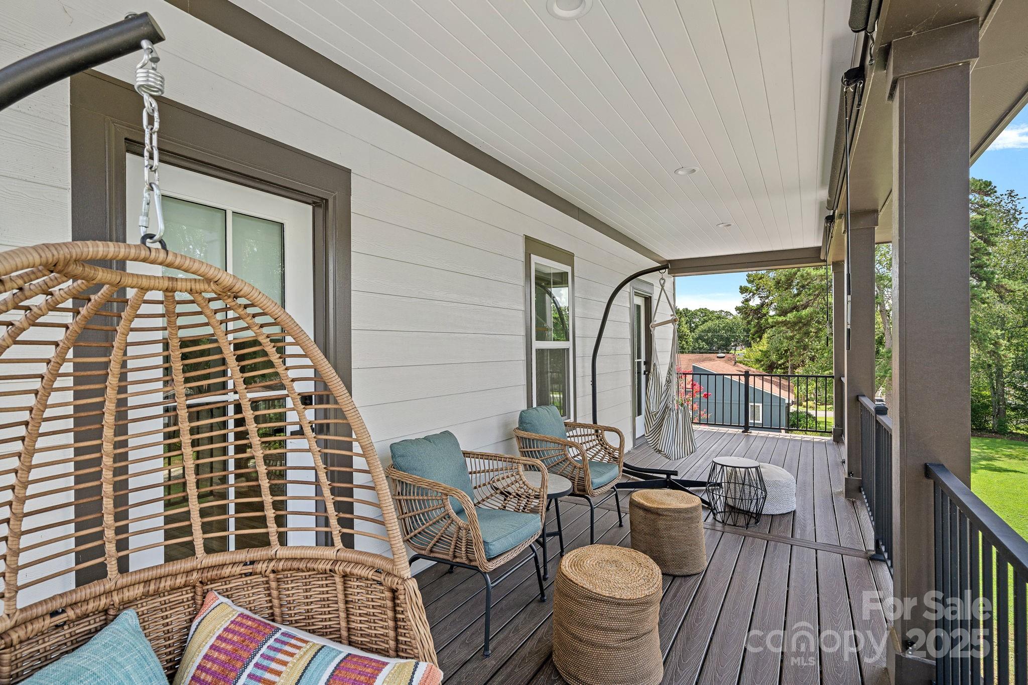 20615 Rio Oro Drive Cornelius, NC 28031 - Photo 27 of 40 a view of balcony with couch and wooden floor