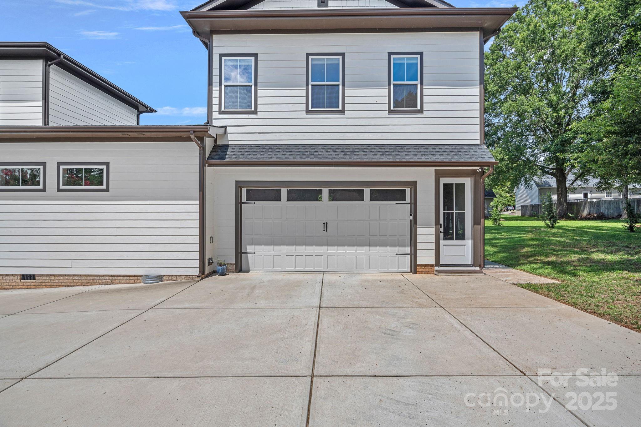 20615 Rio Oro Drive Cornelius, NC 28031 - Photo 28 of 40 a front view of a house with a yard and garage