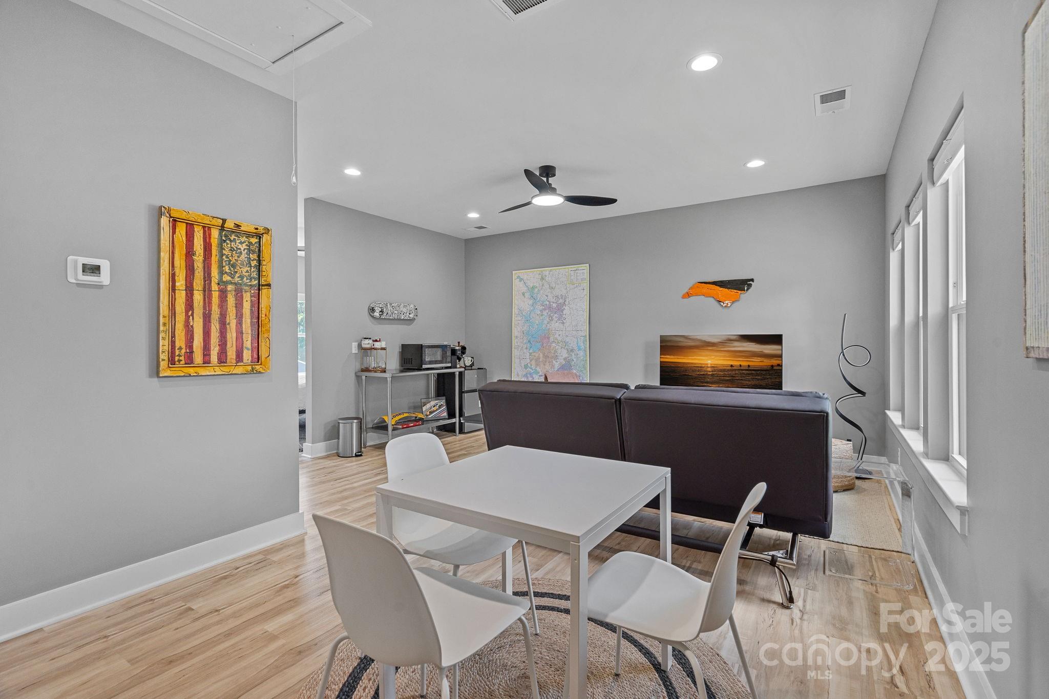 20615 Rio Oro Drive Cornelius, NC 28031 - Photo 30 of 40 a view of a dining room with furniture and wooden floor