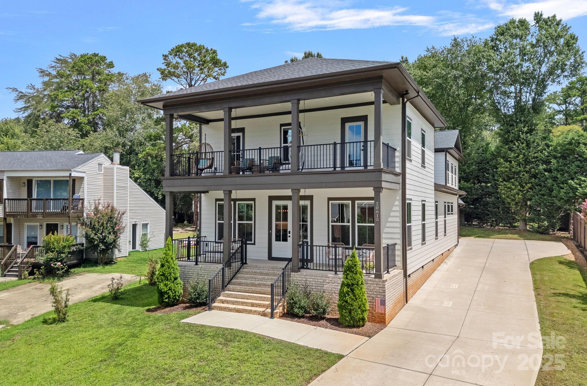 20615 Rio Oro Drive Cornelius, NC 28031 - Photo 3 of 40 front view of a house with a yard