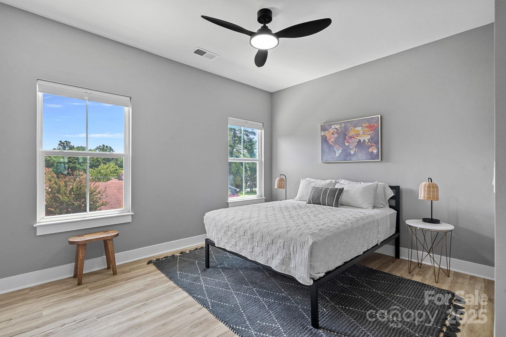 20615 Rio Oro Drive Cornelius, NC 28031 - Photo 33 of 40 a bedroom with a bed a table and chair