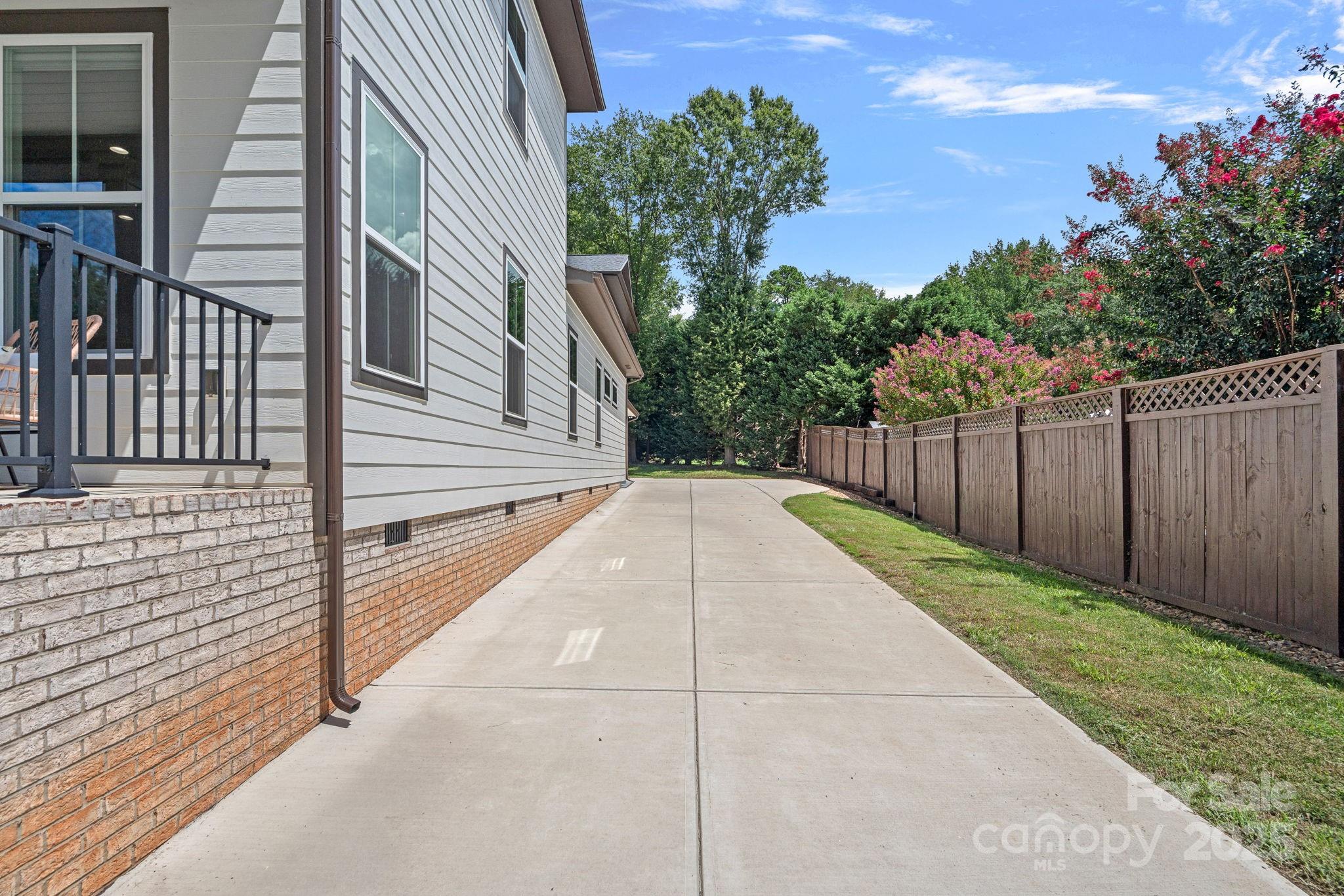 20615 Rio Oro Drive Cornelius, NC 28031 - Photo 36 of 40 a view of a backyard with pathway