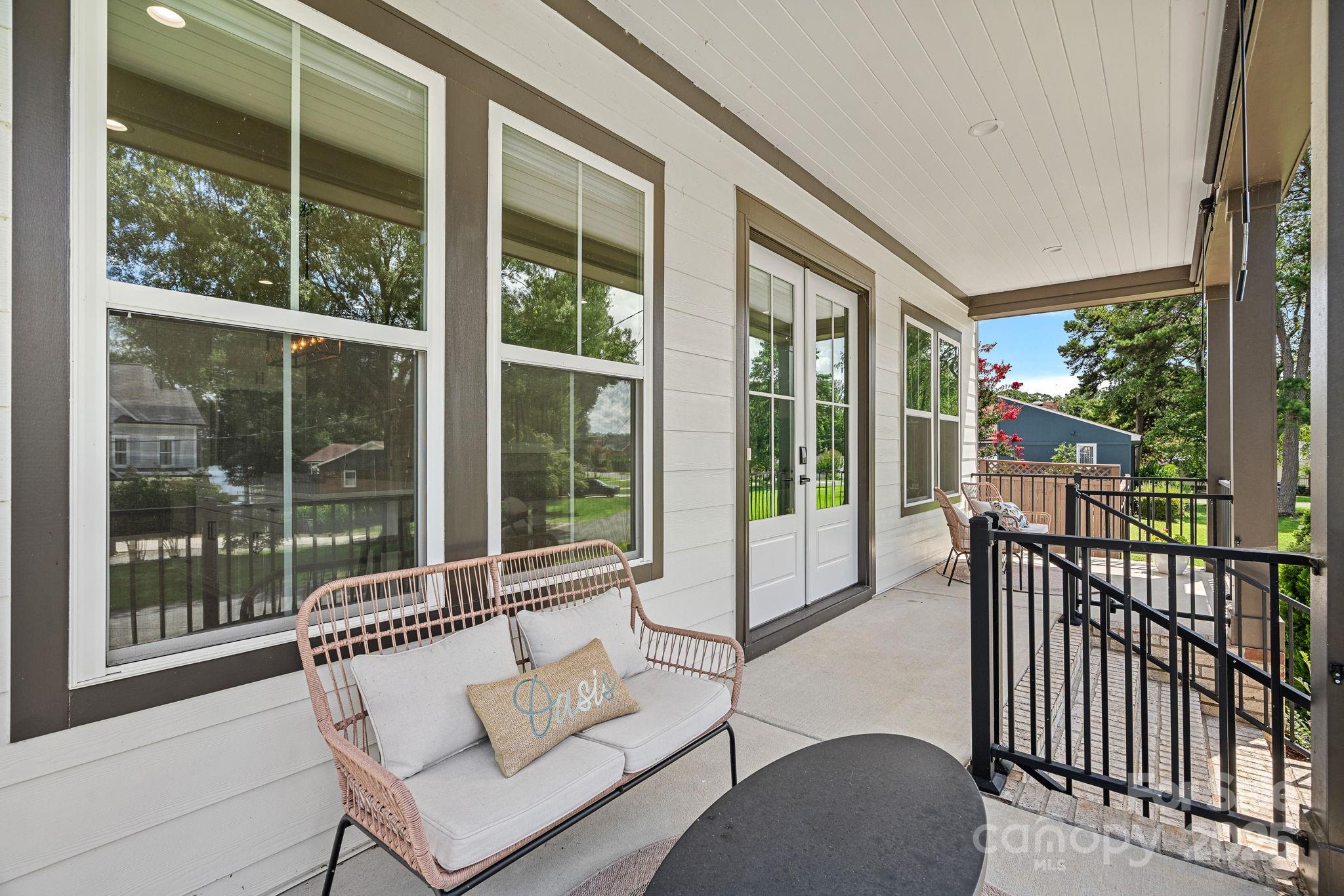 20615 Rio Oro Drive Cornelius, NC 28031 - Photo 4 of 40 a balcony with couple of chairs and a couch