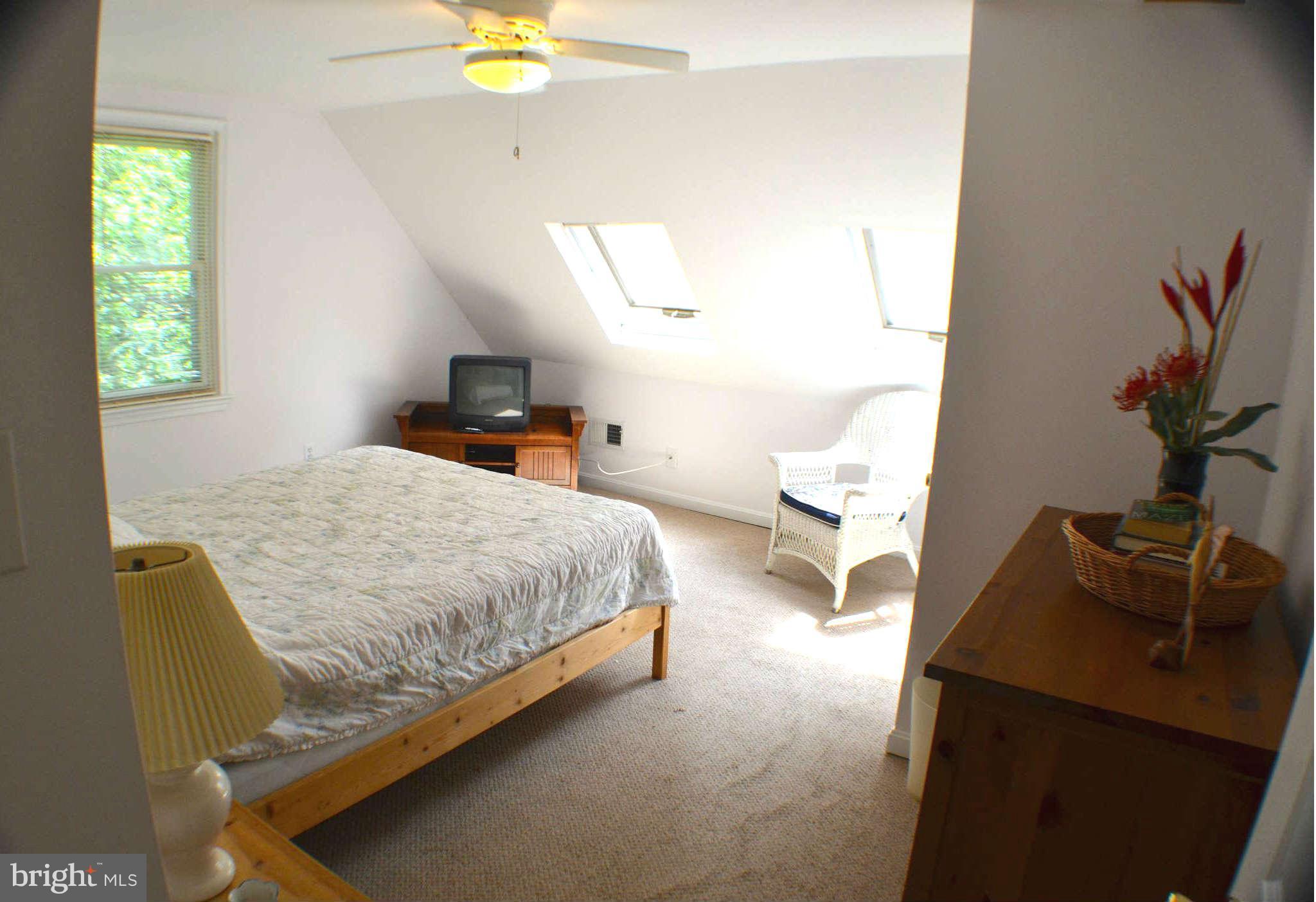 392 Riverside Drive Pasadena, MD 21122 - Photo 10 of 30 a bedroom with a bed and a window
