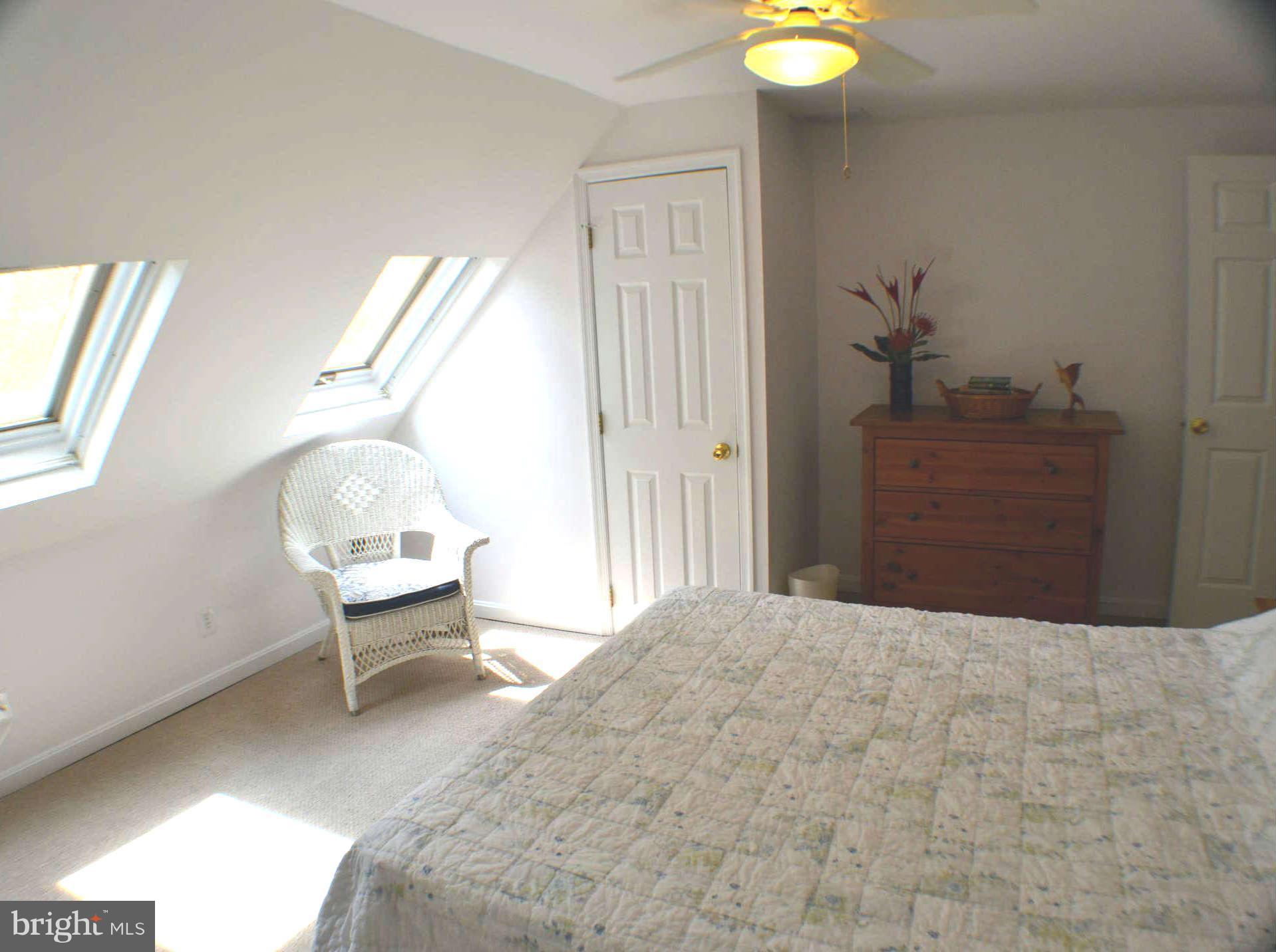 392 Riverside Drive Pasadena, MD 21122 - Photo 11 of 30 a bedroom with a bed and a chair