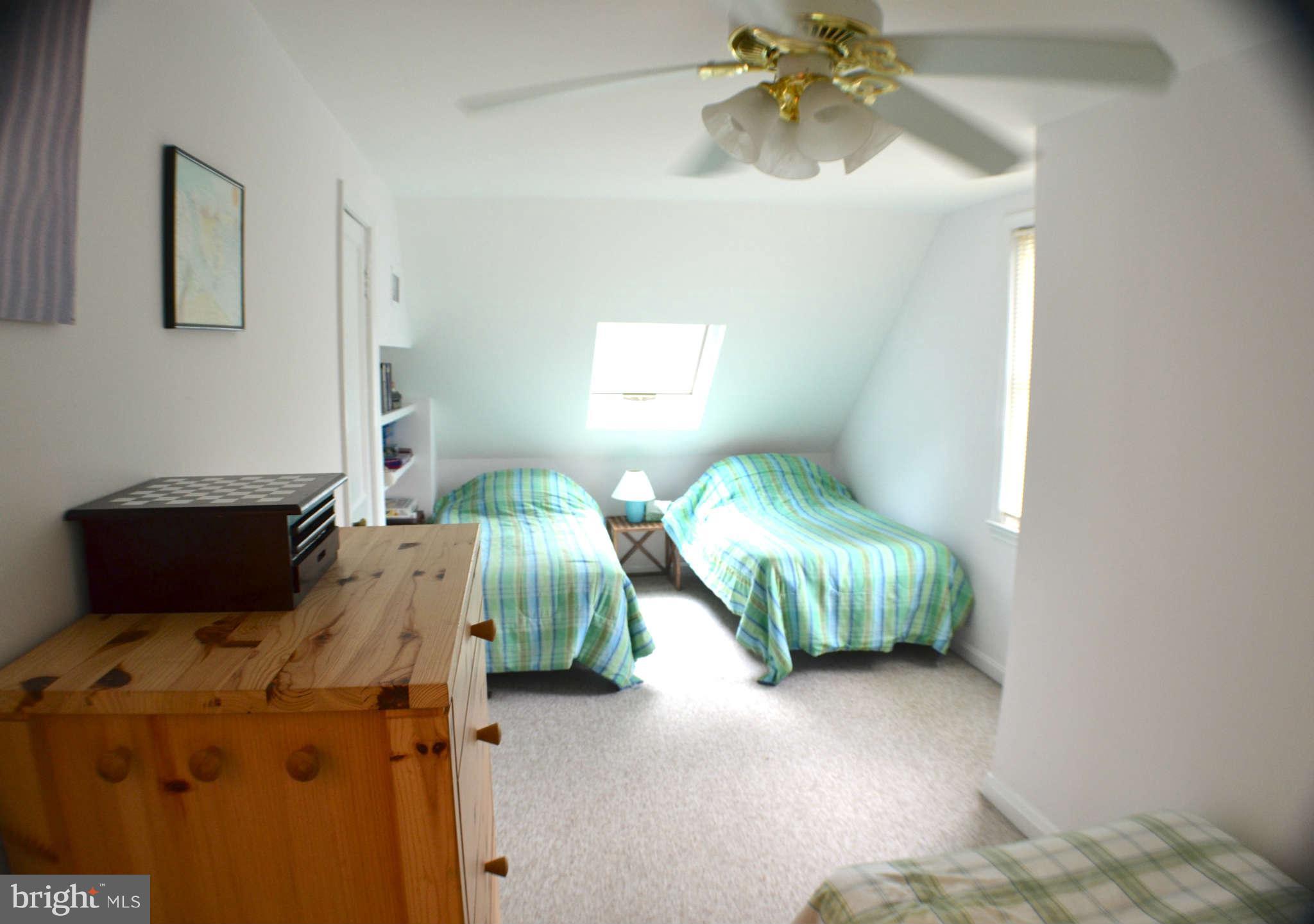 392 Riverside Drive Pasadena, MD 21122 - Photo 12 of 30 a bedroom with a bed and a chandelier