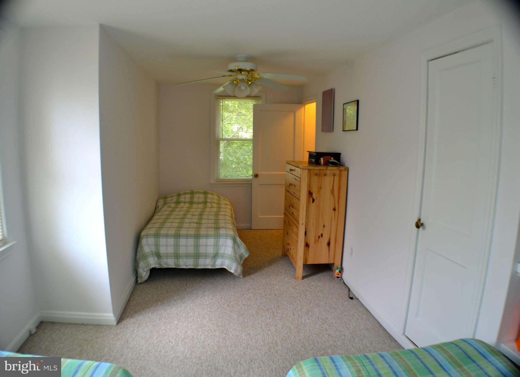 392 Riverside Drive Pasadena, MD 21122 - Photo 13 of 30 a bedroom with bed and window