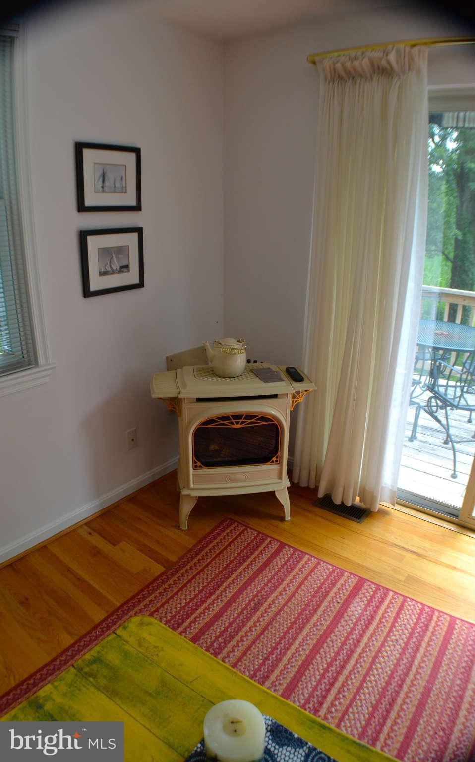 392 Riverside Drive Pasadena, MD 21122 - Photo 18 of 30 a bedroom with a bed and a window