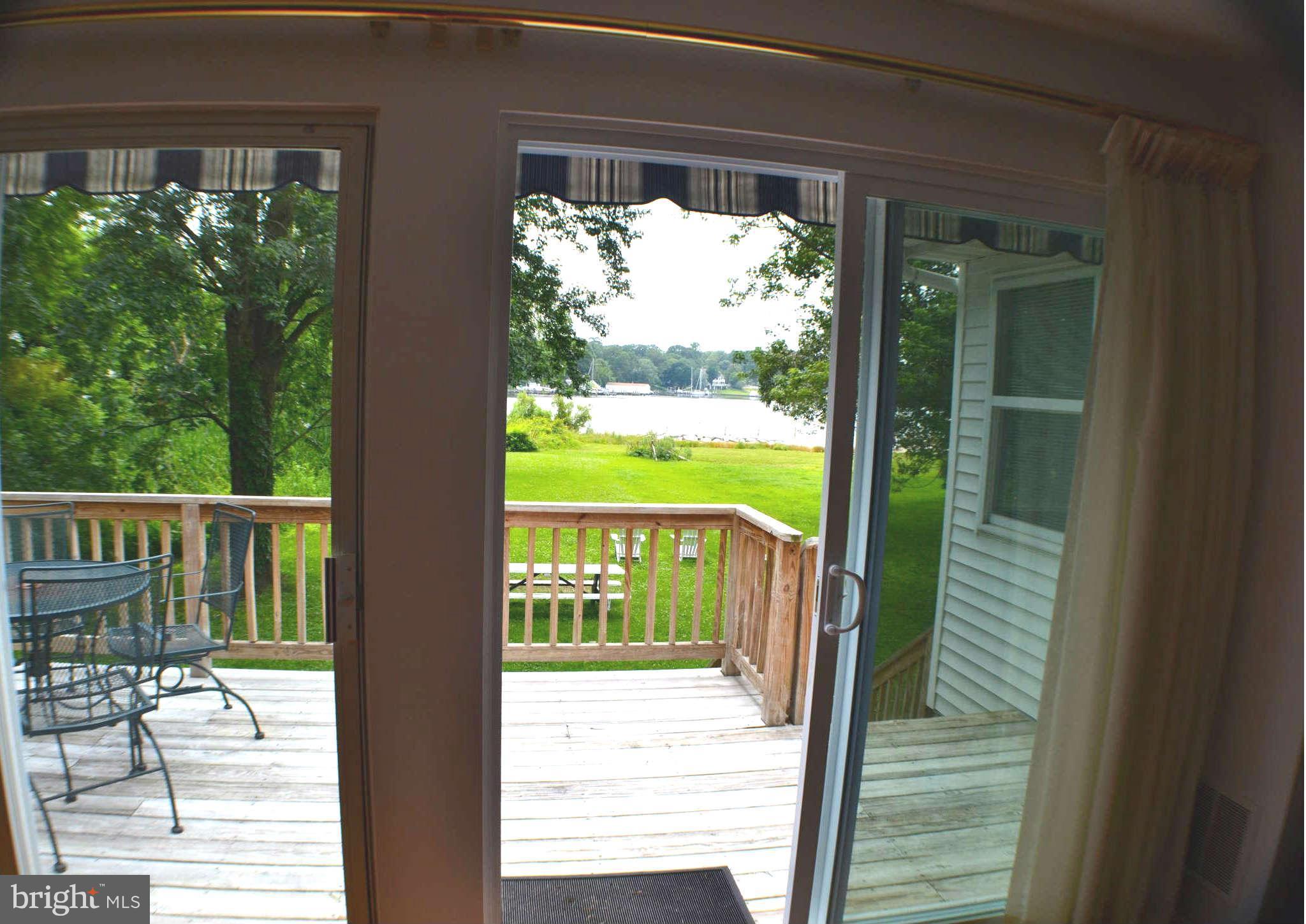 392 Riverside Drive Pasadena, MD 21122 - Photo 19 of 30 a view of a porch with wooden floor and outdoor space
