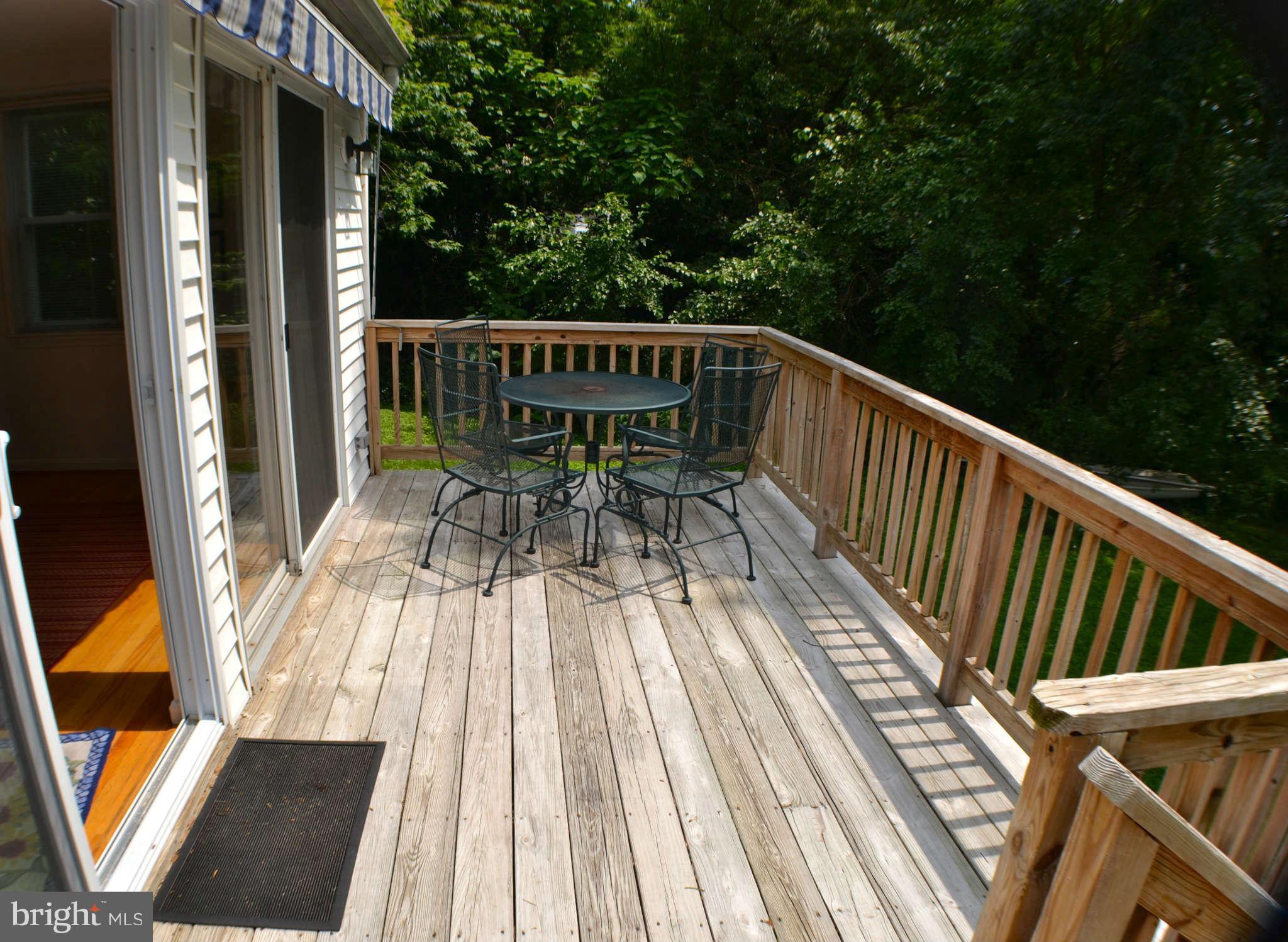 392 Riverside Drive Pasadena, MD 21122 - Photo 20 of 30 a view of balcony with wooden floor and outdoor seating