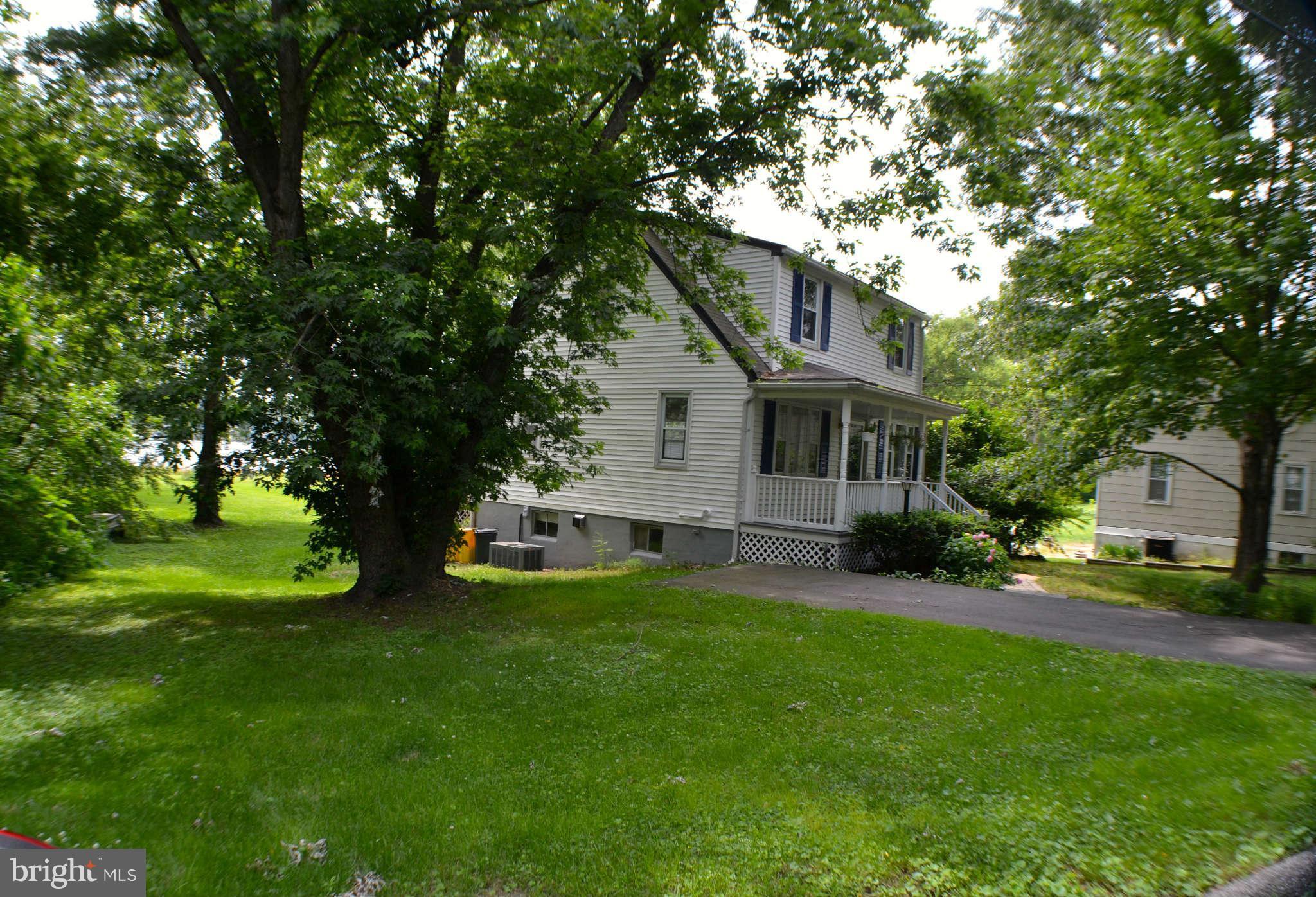392 Riverside Drive Pasadena, MD 21122 - Photo 25 of 30 a view of a house with a backyard