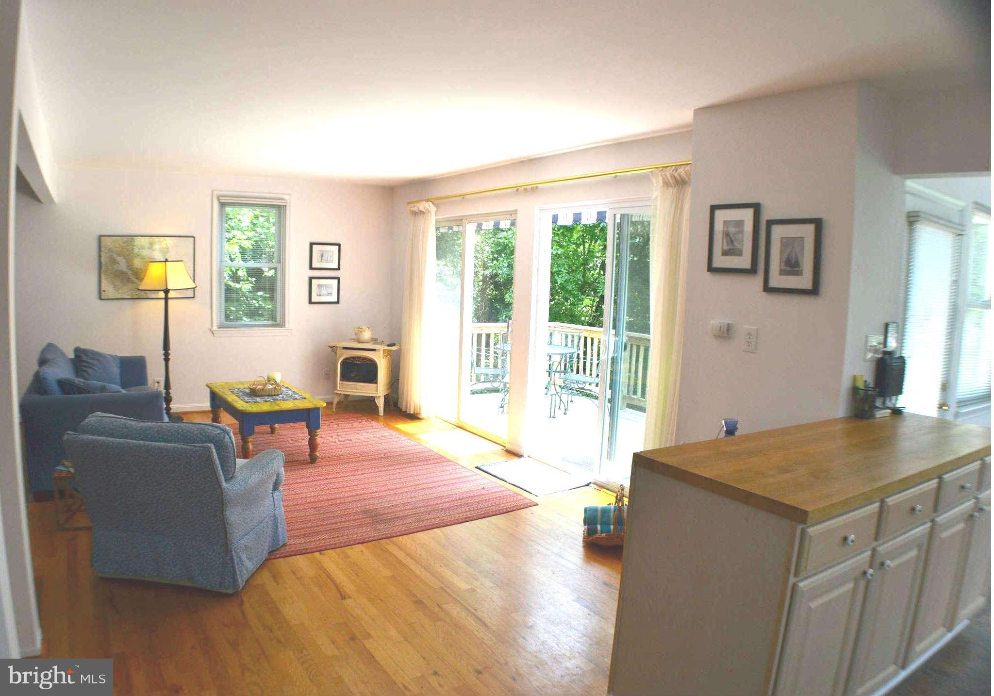 392 Riverside Drive Pasadena, MD 21122 - Photo 6 of 30 a living room with furniture and large windows