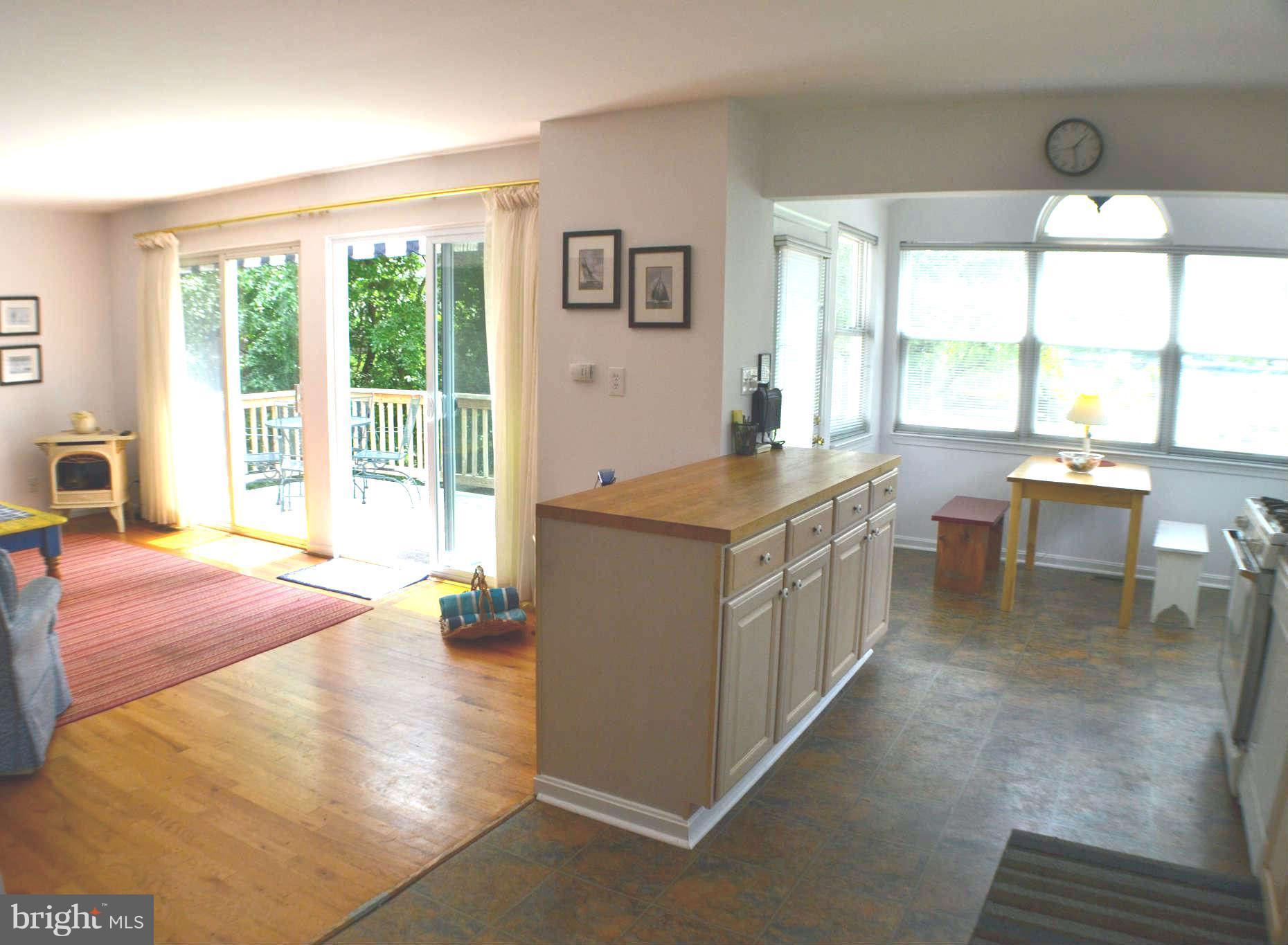 392 Riverside Drive Pasadena, MD 21122 - Photo 30 of 30 a kitchen with a stove a counter top space and a large window