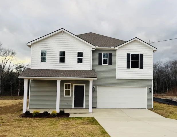a front view of a house with yard