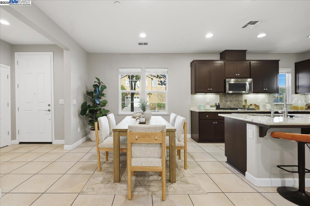 1504 Middle Lane Hayward, CA 94545 - Photo 13 of 60 a kitchen with stainless steel appliances kitchen island granite countertop a refrigerator and cabinets