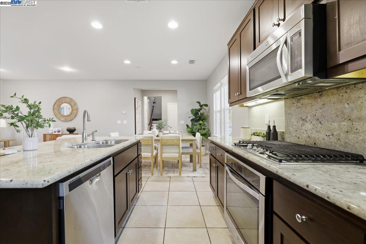 1504 Middle Lane Hayward, CA 94545 - Photo 19 of 60 a kitchen with stainless steel appliances granite countertop a sink stove and cabinets