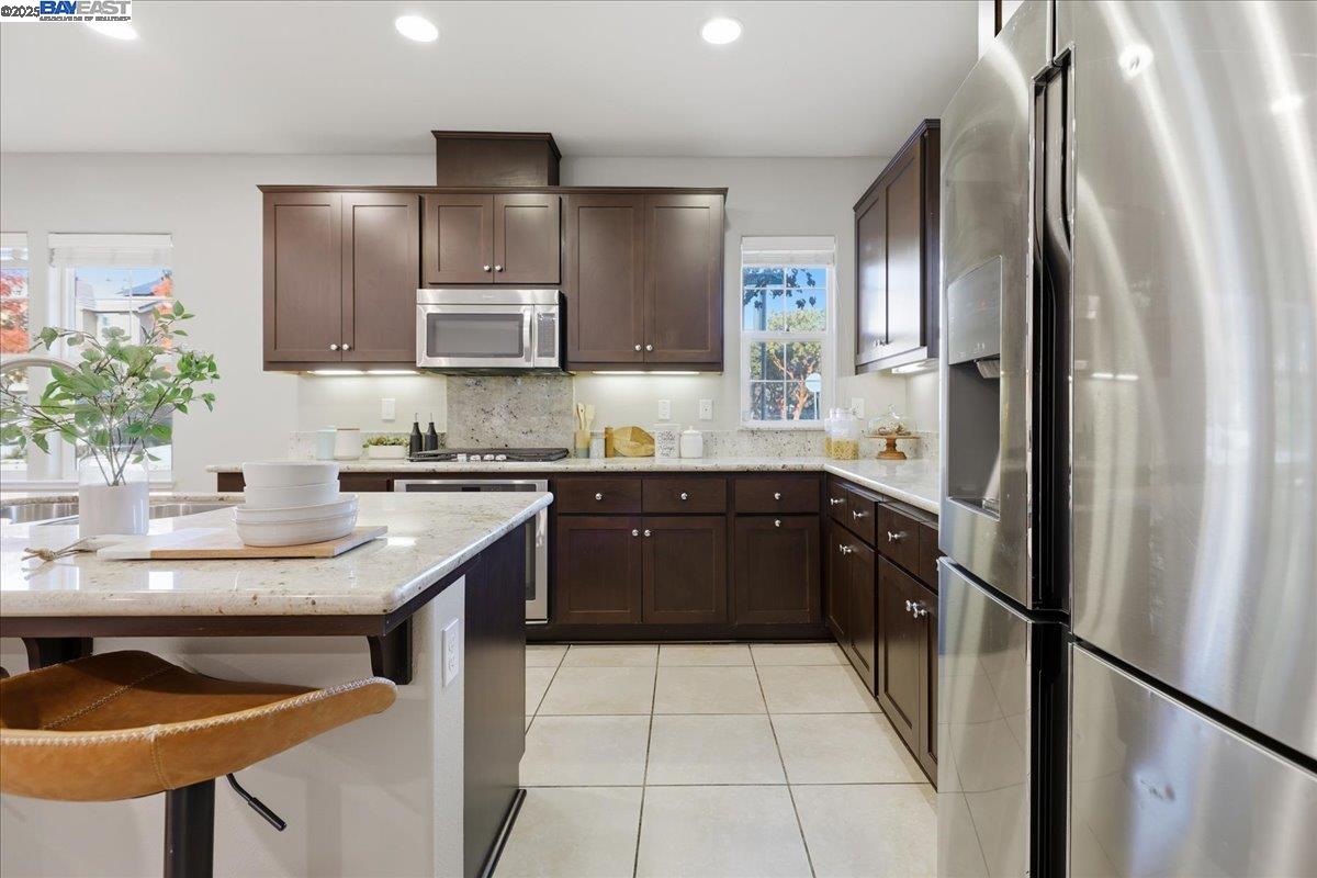 1504 Middle Lane Hayward, CA 94545 - Photo 20 of 60 a kitchen with stainless steel appliances granite countertop a sink stove and refrigerator