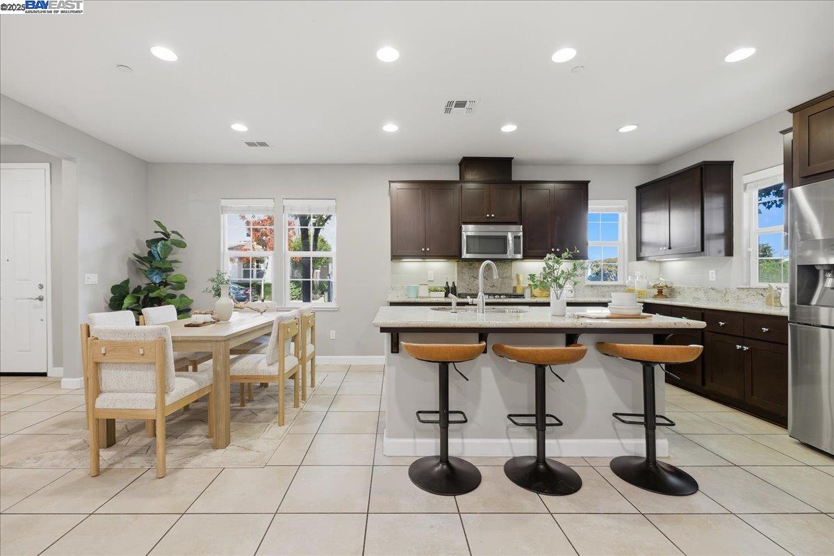 1504 Middle Lane Hayward, CA 94545 - Photo 22 of 60 a kitchen with stainless steel appliances kitchen island granite countertop a sink and a white cabinets