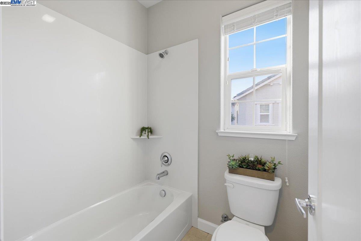 1504 Middle Lane Hayward, CA 94545 - Photo 35 of 60 a white bath tub sitting next to a white toilet