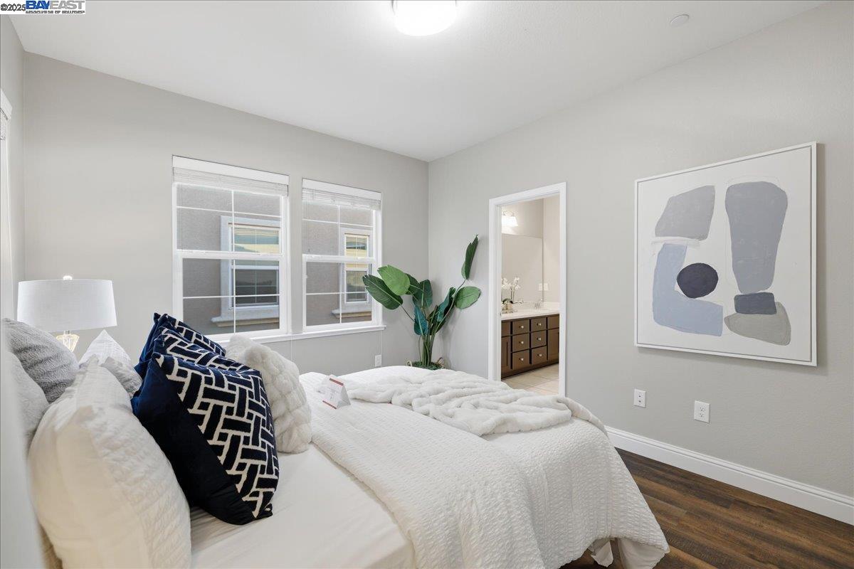 1504 Middle Lane Hayward, CA 94545 - Photo 38 of 60 a bedroom with a large bed and a potted plant