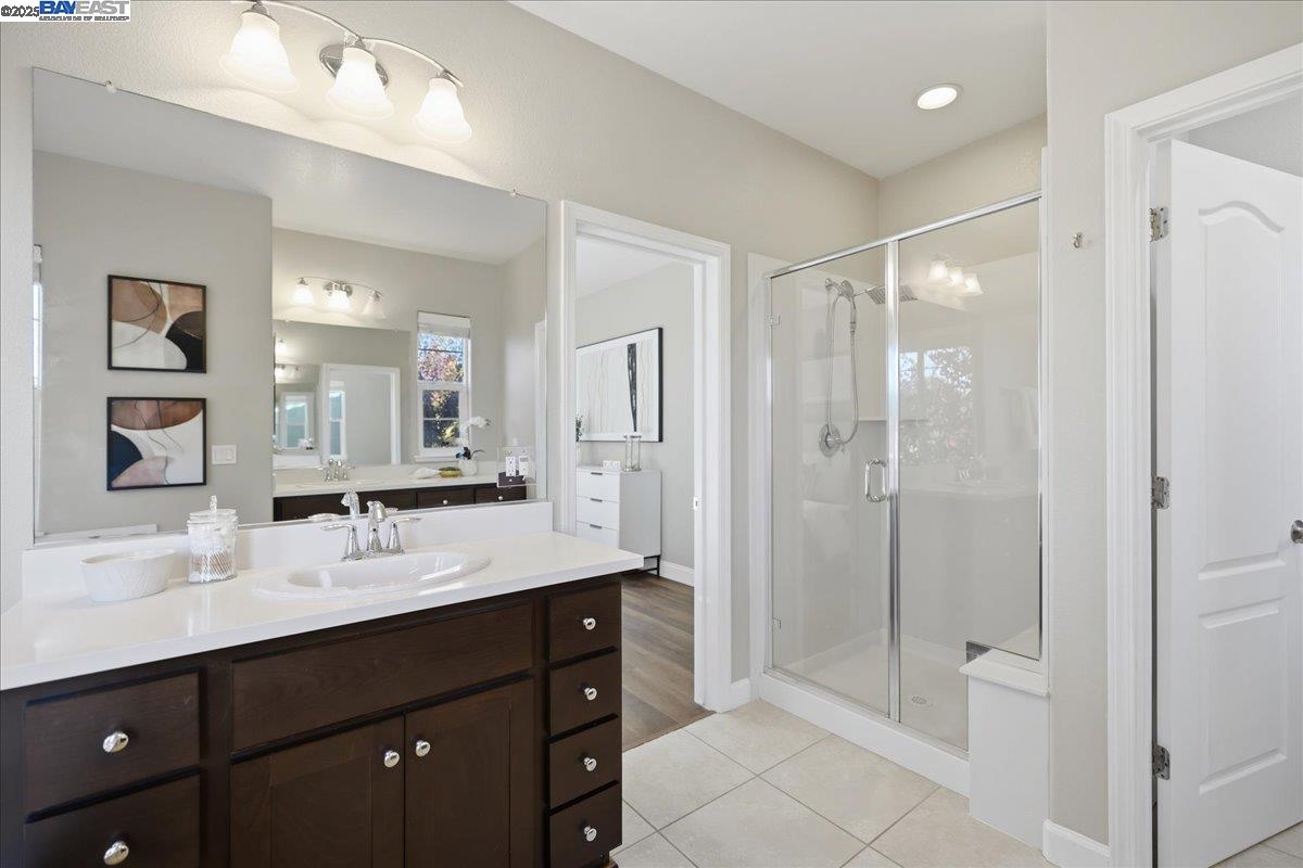 1504 Middle Lane Hayward, CA 94545 - Photo 49 of 60 a bathroom with a shower sink double and mirror