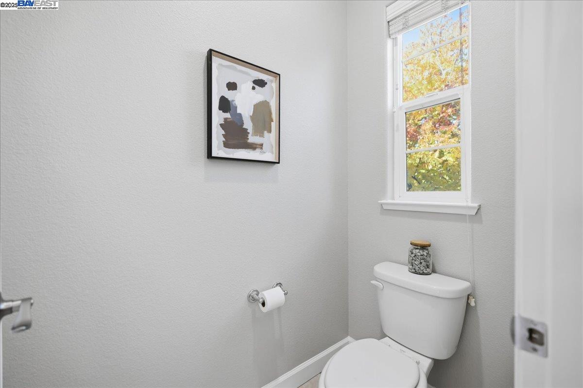1504 Middle Lane Hayward, CA 94545 - Photo 53 of 60 a white toilet sitting next to a bathroom sink