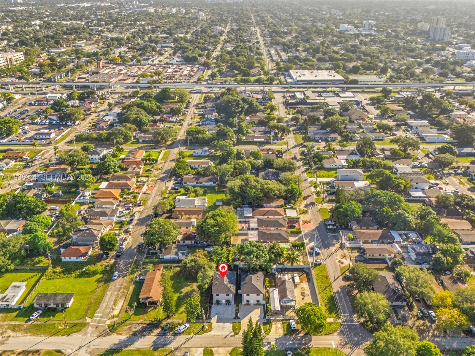 5821 Northwest 30th Avenue Miami, FL 33142 - Photo 14 of 14 an aerial view of residential houses with street