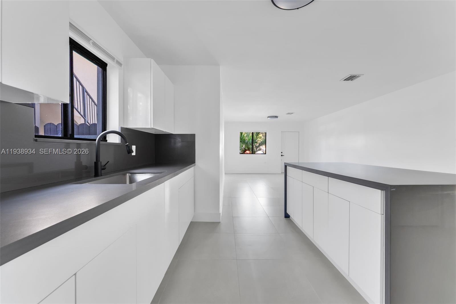 5821 Northwest 30th Avenue Miami, FL 33142 - Photo 4 of 14 a view of a hallway with wooden floor