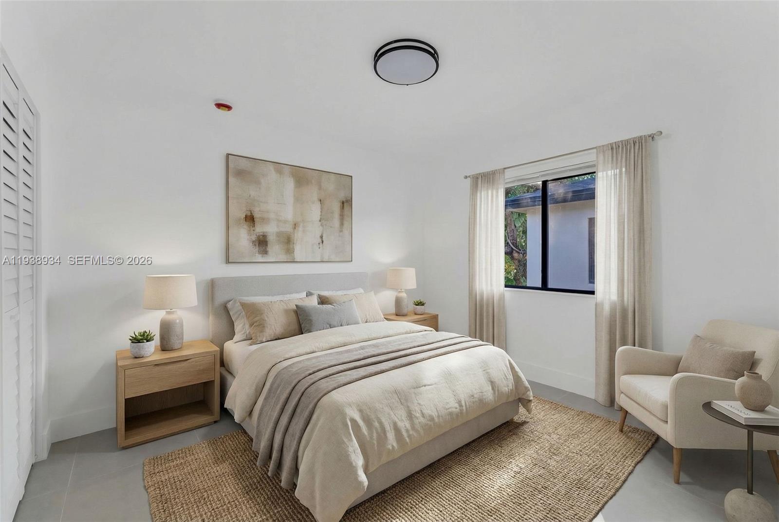 5821 Northwest 30th Avenue Miami, FL 33142 - Photo 9 of 14 a bedroom with a bed and a lamp