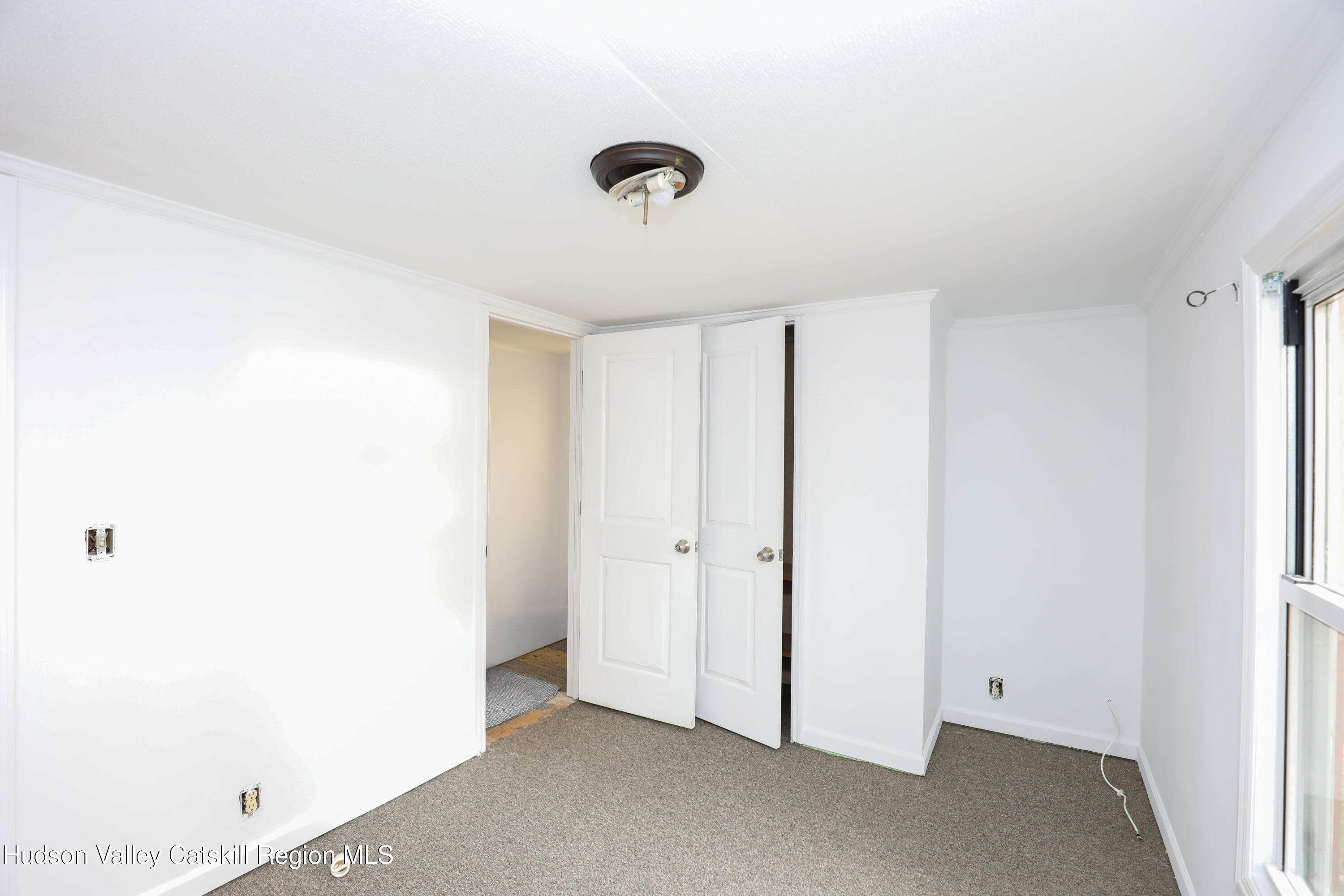 130 Timberwall Road, Unit 24 Saugerties, NY 12477 - Photo 15 of 20 a view of a livingroom with a ceiling fan