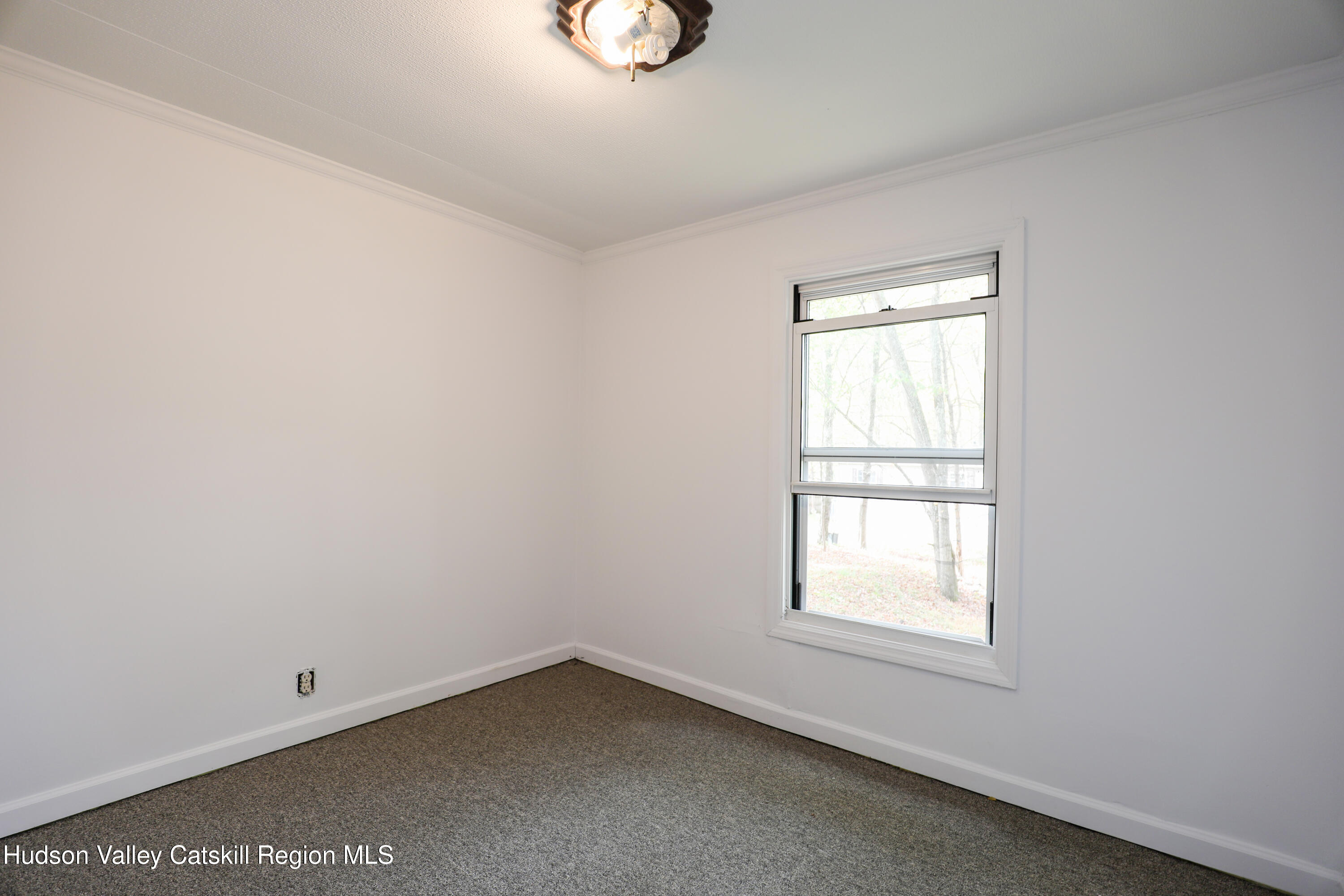 130 Timberwall Road, Unit 24 Saugerties, NY 12477 - Photo 17 of 20 an empty room with a window