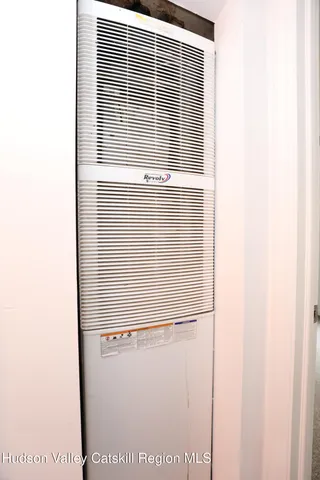 a view of house with backyard and trees