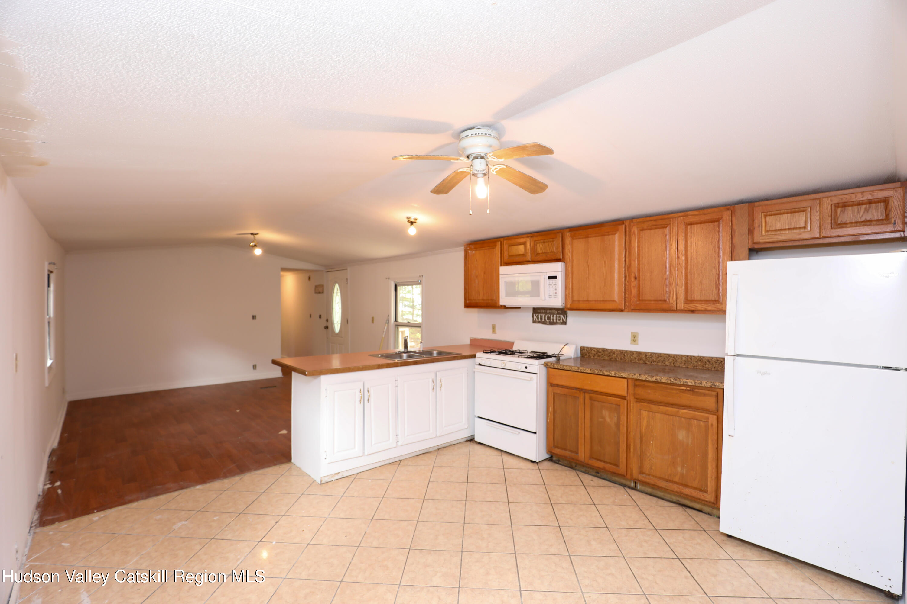 130 Timberwall Road, Unit 24 Saugerties, NY 12477 - Photo 9 of 20 a kitchen with a cabinets and white appliances