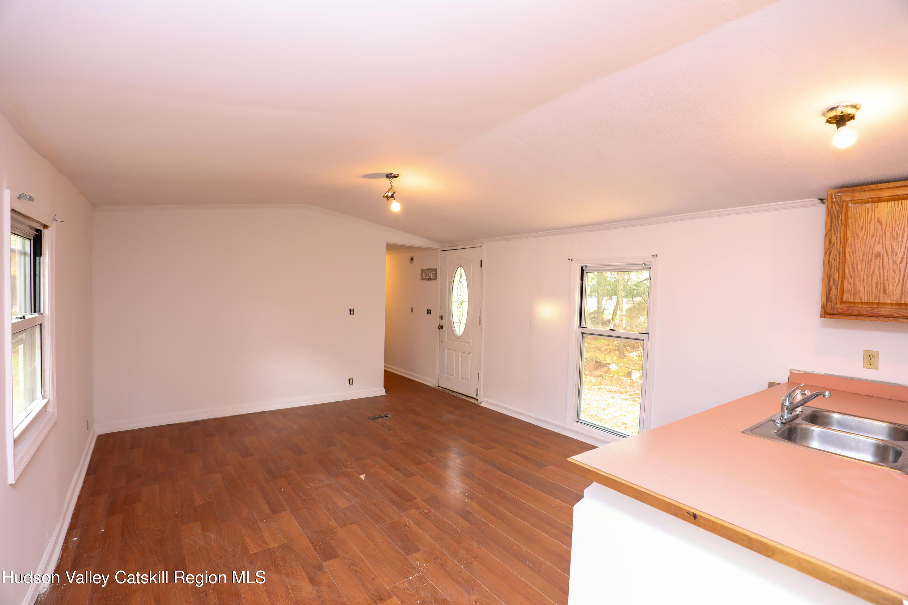 130 Timberwall Road, Unit 24 Saugerties, NY 12477 - Photo 10 of 20 wooden floor in an empty room with a window