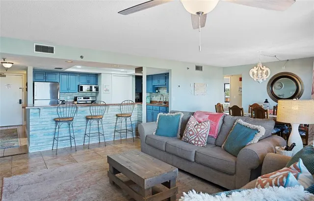 a living room with furniture and a outdoor space