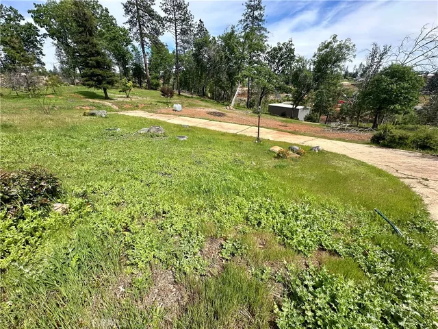 a swimming pool with an outdoor space and seating area