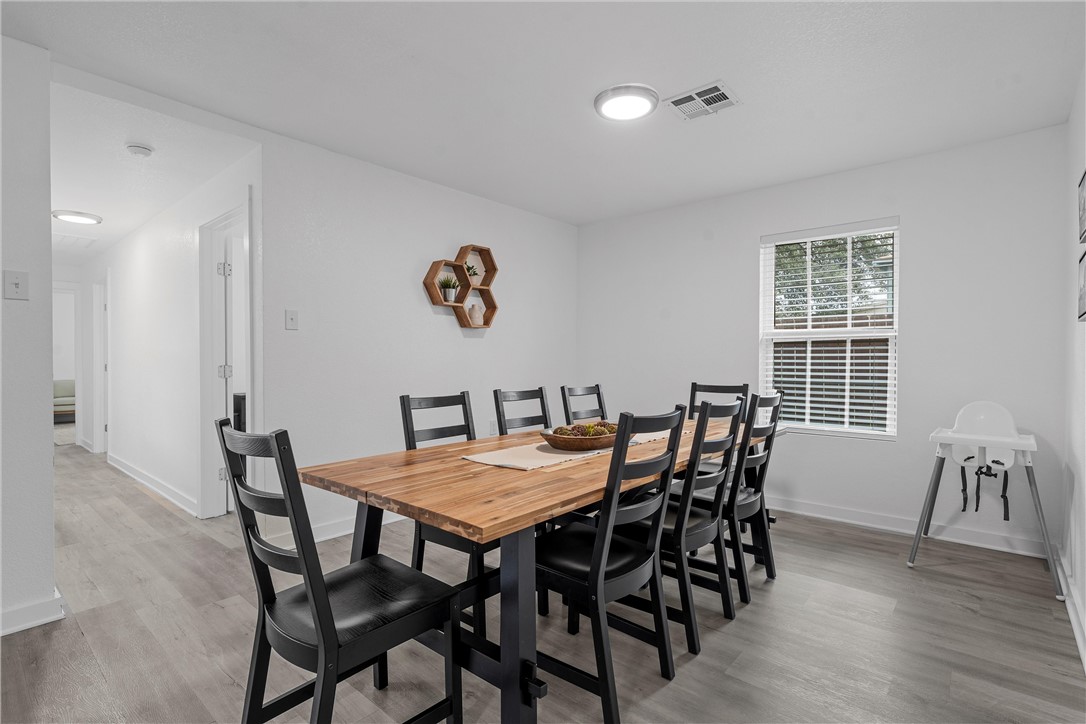 621 South 9th Street Waco, TX 76706 - Photo 14 of 31 a view of a dining room with furniture and wooden floor