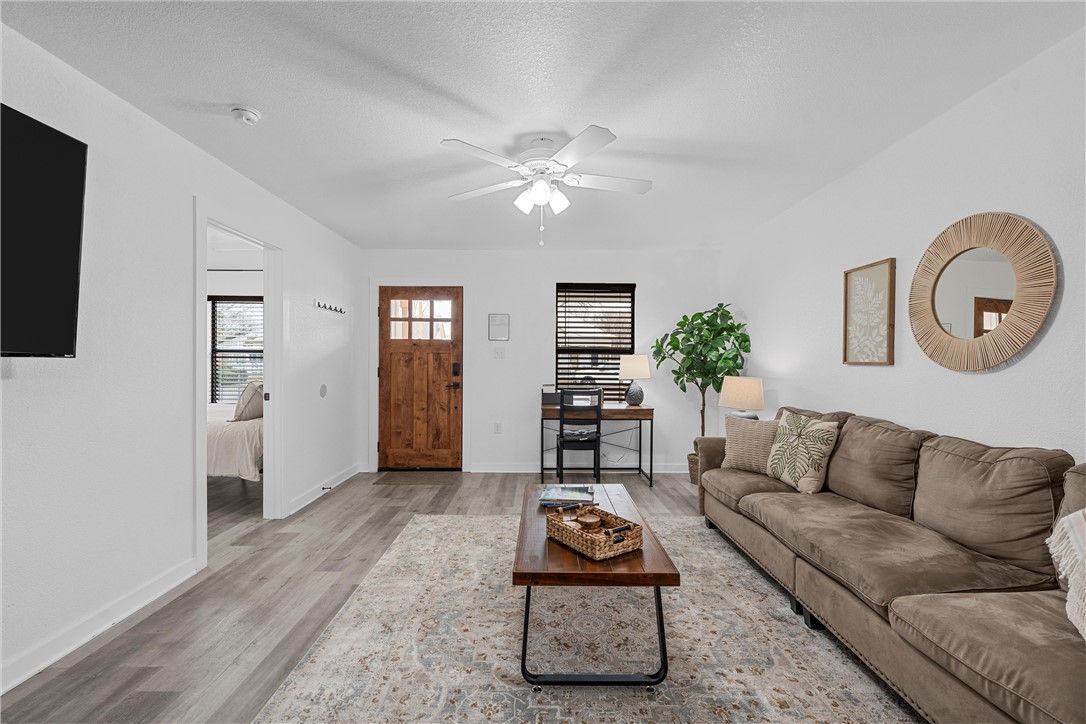 621 South 9th Street Waco, TX 76706 - Photo 4 of 31 a living room with furniture and wooden floor