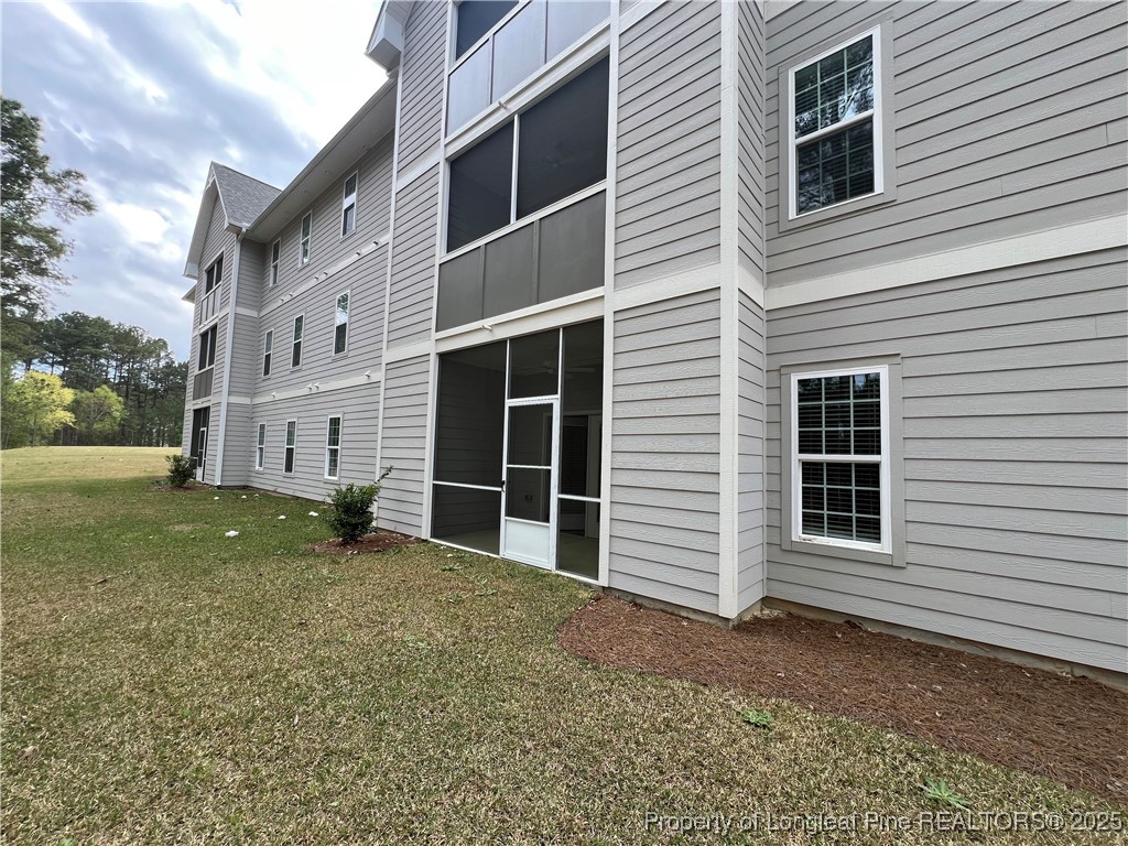 260 Gallery Drive, Unit 101 Spring Lake, NC 28390 - Photo 24 of 31 a view of a house with a yard