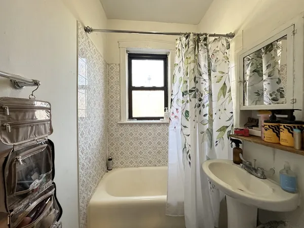 a bathroom with a sink a toilet and a bathtub