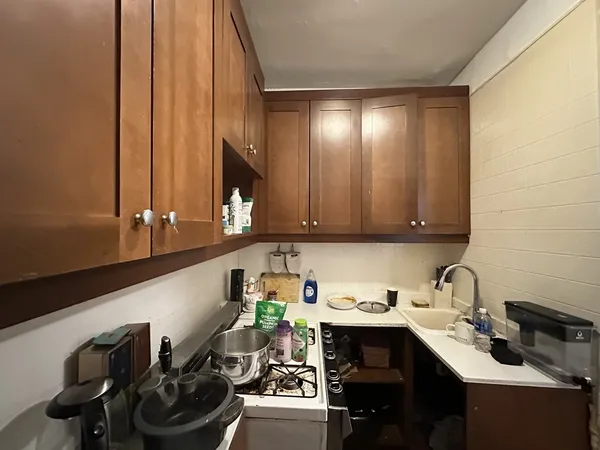 a kitchen with a sink and cabinets