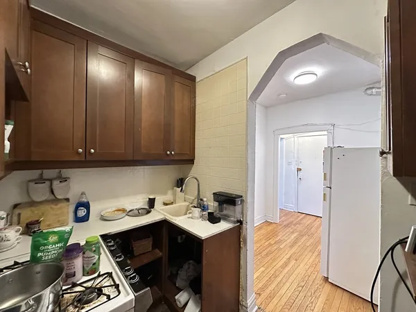 a kitchen with a sink cabinets and appliances
