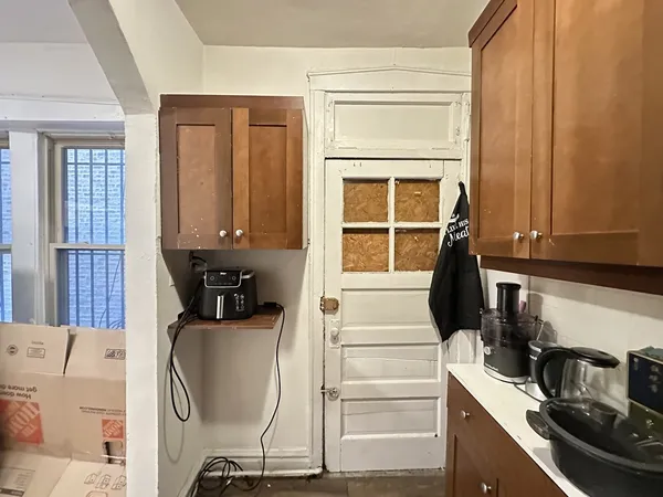 a kitchen with a sink a stove and cabinets
