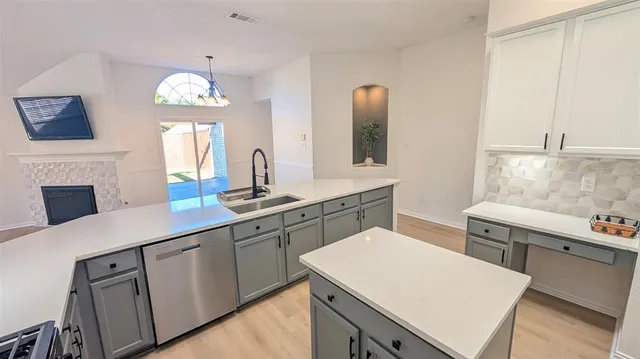 a kitchen with a table chairs and a stove