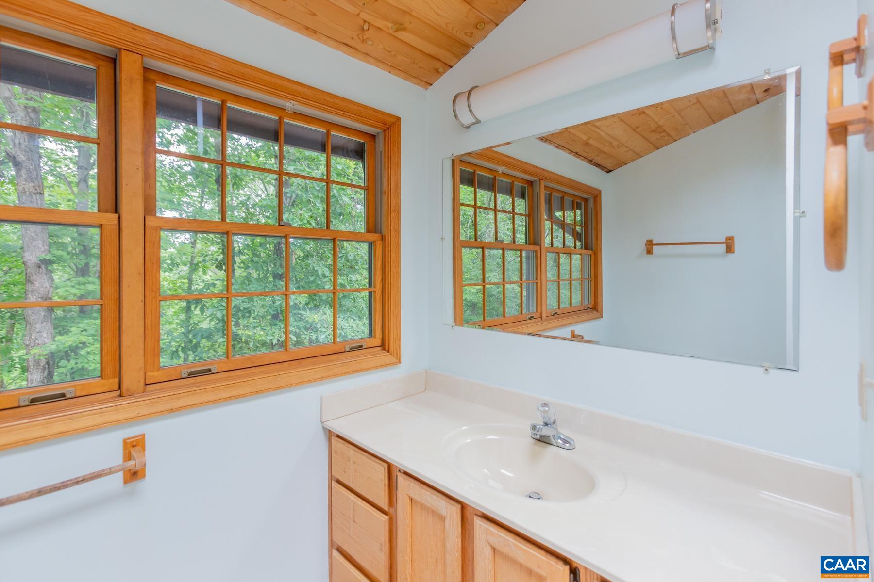21 Briarwood Road Palmyra, VA 22963 - Photo 20 of 37 a bathroom with a sink and a window