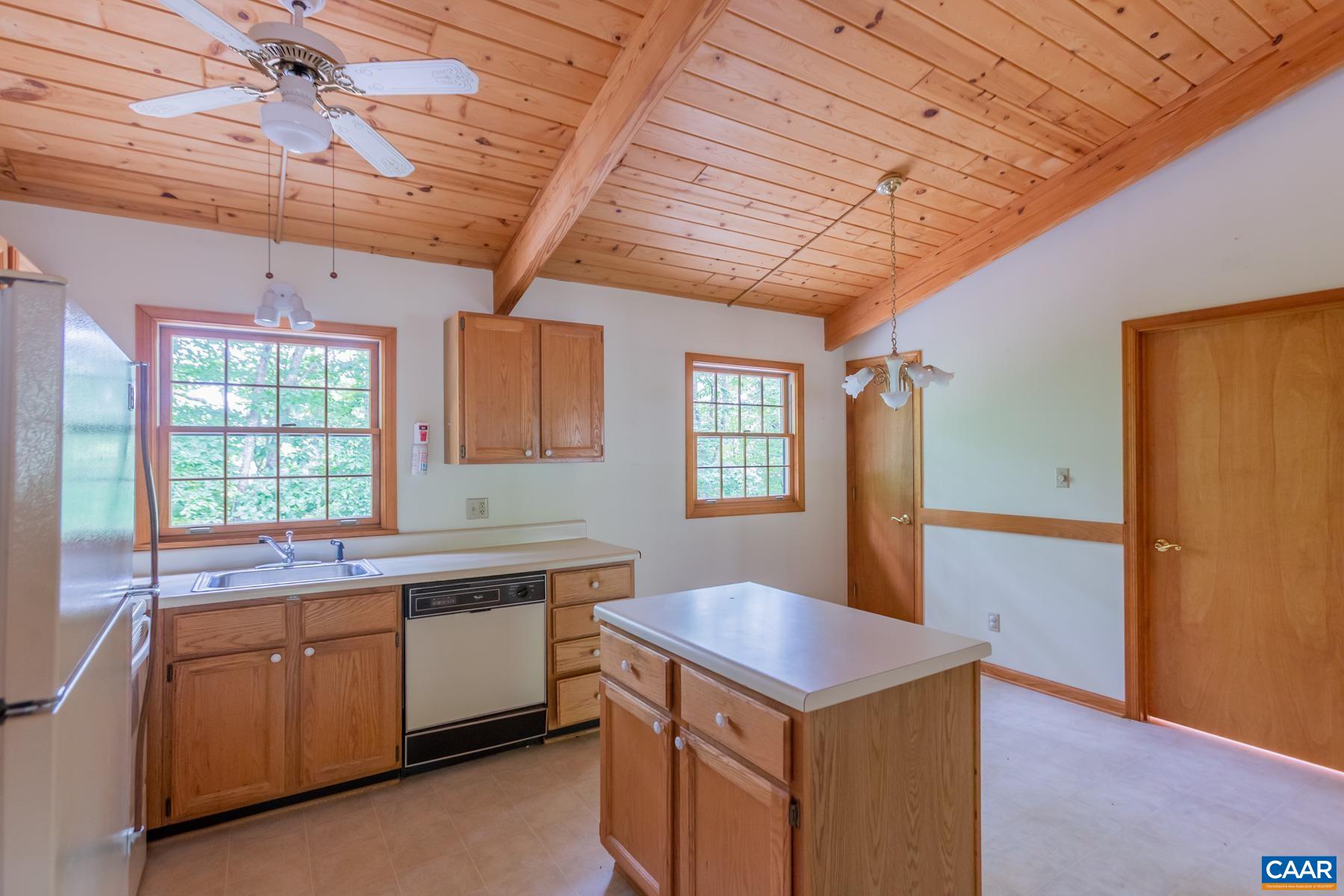 21 Briarwood Road Palmyra, VA 22963 - Photo 23 of 37 a kitchen with a stove sink and cabinets